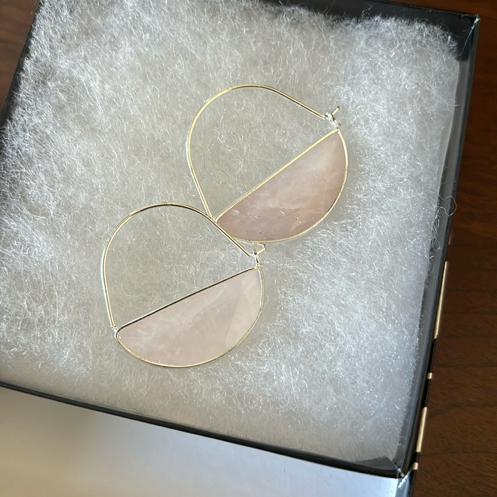 Woman’s pink/moonstone color earrings. Hook and loop closure.